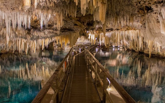 Stunning crystal caves underground with blue sea water